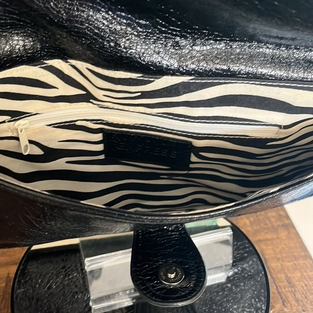 Express Black faux leather envelope clutch, with zebra pattern lining